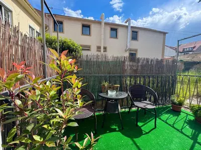 a patio with a table and chairs and a fence at Apartmán Dlouhá 207 in Litoměřice