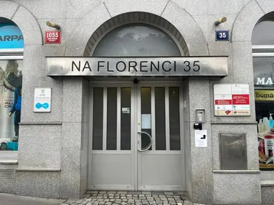 a building with a door with a sign above it at Powder Tower Suites in Prague