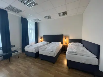 a hotel room with two beds in a room at Powder Tower Suites in Prague