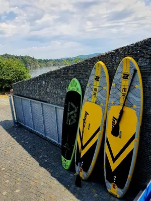 three snowboards leaned up against a brick wall at Pláž Hrdlička in Buš