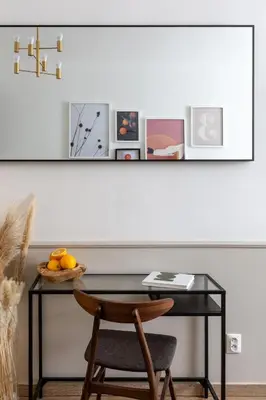 a table with a chair next to a white wall at TurnKey I Elegant Studio by National Museum in Prague