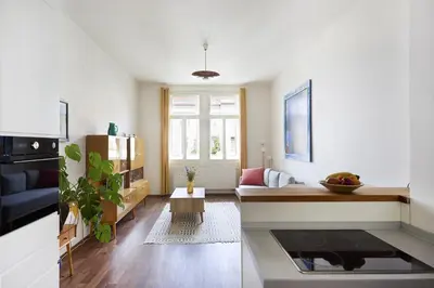 a living room with a couch and a table at Mama's apartment in Letna in Prague