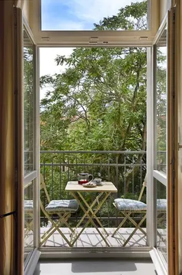 a view of a balcony with a table and chairs at Mama's apartment in Letna in Prague