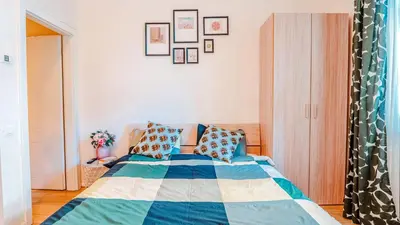 a bedroom with a bed with a blue at Prague Retreat Apartment in Prague