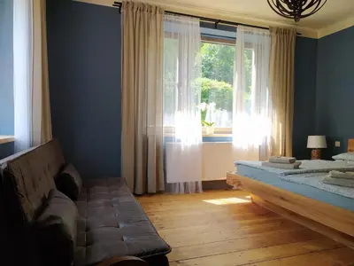 a bedroom with a bed and a window at Pod hradbami Křivoklát in Křivoklát
