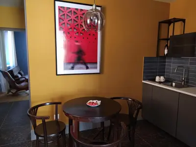 a kitchen with a table and chairs and a sink at Pod hradbami Křivoklát in Křivoklát