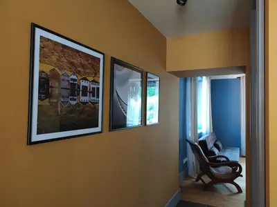 a room with four pictures on the wall at Pod hradbami Křivoklát in Křivoklát