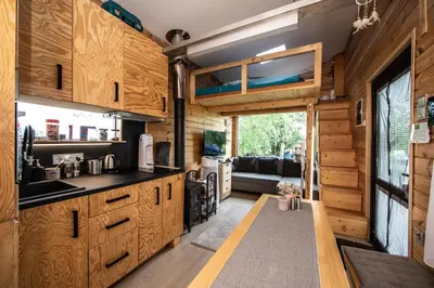 a kitchen and living room in a tiny house at Tiny house - Chatka v Řeži u Prahy in Husinec