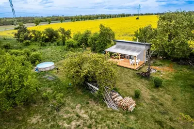 an overhead view of a small house in a field at Tiny house - Chatka v Řeži u Prahy in Husinec