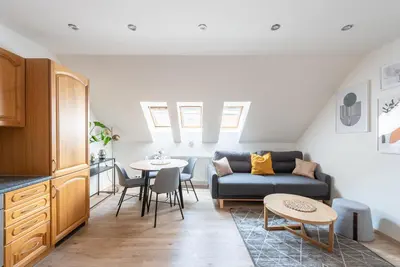 a living room with a couch and a table at B.O.B. Klimentská in Prague