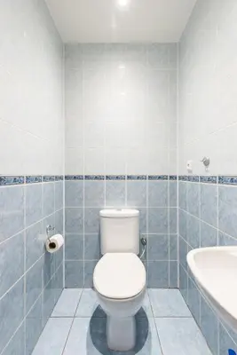 a bathroom with a white toilet and a sink at B.O.B. Klimentská in Prague