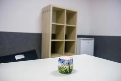 a vase sitting on top of a white table at Hostel Seven in Prague