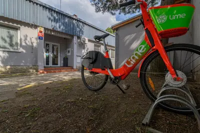 a red bike parked in front of a building at Hostel Seven in Prague