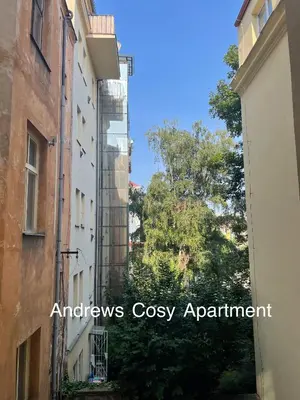 an alley between two buildings with the words honors cosy apartment at Andrews Cosy Apartment in Prague
