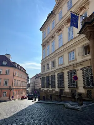 a building with a flag on the side of a street at Apartment DeLuxe in Prague