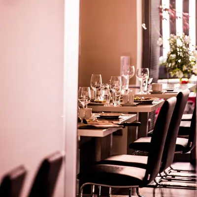 a long table with wine glasses on it at Hotel U Karla in Prague