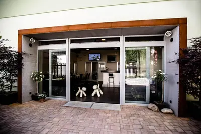 a large glass door with two people on it at Hotel U Karla in Prague