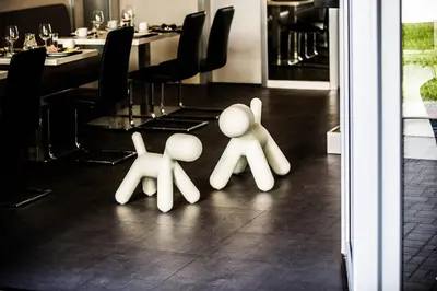 two white people standing on the floor of a restaurant at Hotel U Karla in Prague