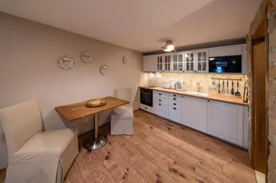 a bathroom with a washing machine and a sink at Prague West - Studio Chyne Terrace in Chýně