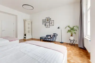 an empty room with white walls and wood floors at Cool & Charming Apt in city center - lub5 in Prague