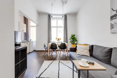 a white kitchen with a sink and a refrigerator at Cool & Charming Apt in city center - lub5 in Prague