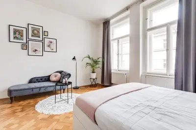 a living room with a couch and a table at Cool & Charming Apt in city center - lub5 in Prague