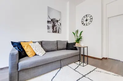 two beds in a room with a brick wall at Cool & Charming Apt in city center - lub5 in Prague