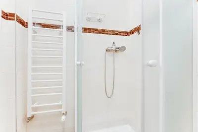 a bedroom with two beds and a brick wall at Cool & Charming Apt in city center - lub5 in Prague