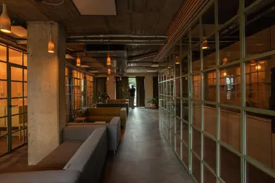 a row of couches in a room with windows at Cool place in Prague