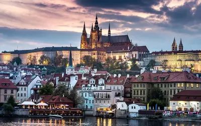 a view of a city with a castle in the background at Prague Central Apartment in Prague