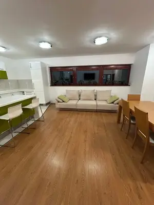 a living room with a couch and a table at Krásné ubytování s balkonem in Prague