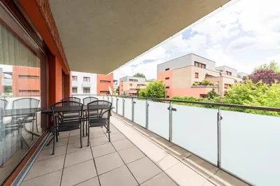 a balcony with chairs and a table on it at Krásné ubytování s balkonem in Prague