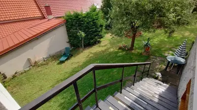 an aerial view of a balcony with a yard at Prague Zbraslav Old Garden in Prague