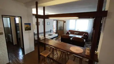 a living room with a table and a living room at Prague Zbraslav Old Garden in Prague