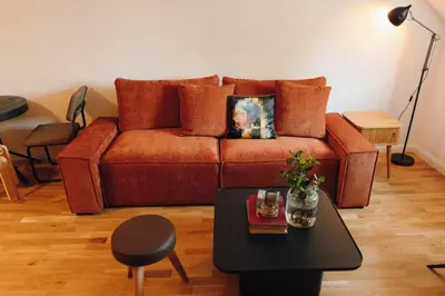 a living room with a couch and a table at Modern Mezzanine Apt at Jecna st in Prague