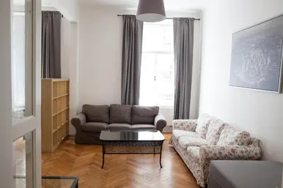 a living room with a couch and a coffee table at 2 Bed Flat - Sleeps 9 - Pets - Smoking on terrace in Prague