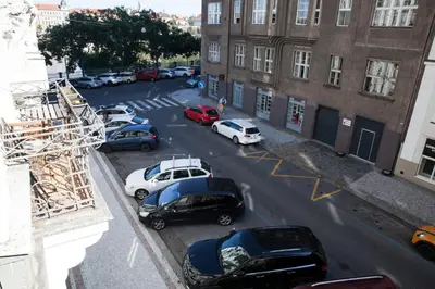 an aerial view of a parking lot with cars parked at 2 Bed Flat - Sleeps 9 - Pets - Smoking on terrace in Prague