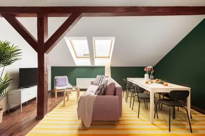 a living room with a table and a couch at Prague Days - Modern Apartments just 7 min from Wenceslas Square in Prague