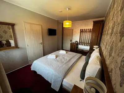 a hotel room with two beds in a room at Elodia in Choťánky