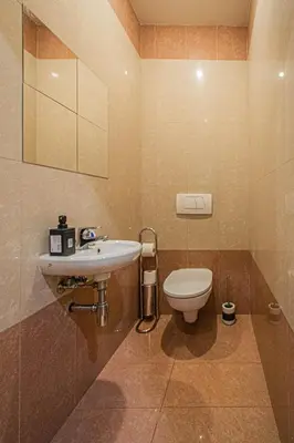 a bathroom with a sink and a toilet at Central 2BDR flat behind Museum in Prague