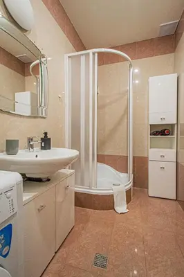 a bathroom with a shower and a sink at Central 2BDR flat behind Museum in Prague