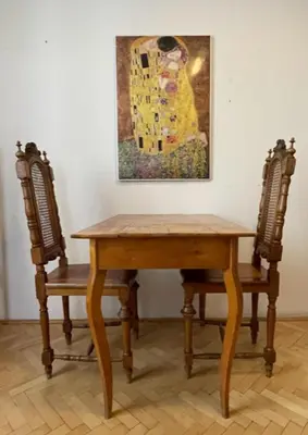 a table and two chairs in a room with a painting at 1 Bed Flat - Sleeps 2 - Pets - Wifi in Prague