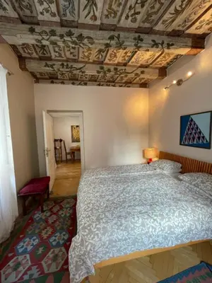 a bedroom with a bed and a coffered ceiling at 1 Bed Flat - Sleeps 2 - Pets - Wifi in Prague