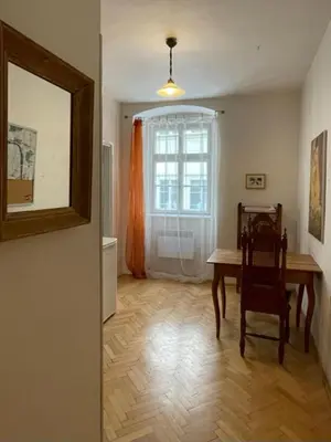 a dining room with a table and a window at 1 Bed Flat - Sleeps 2 - Pets - Wifi in Prague