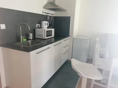 a kitchen with a sink and a microwave at Brand new one bedroom apartment #54 in brand new building with free parking in Prague