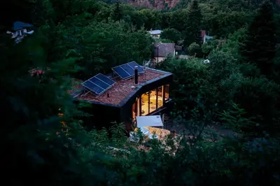 an overhead view of a house with solar panels on the roof at Chata nad Kocábou in Štěchovice