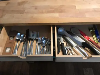 a wooden drawer with utensils in it at Fun Tiki Vibe Apartment / Charles Bridge / Netflix in Prague