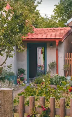 a house with a red roof and a garden at Domeček na Květinovém statku in Zdice
