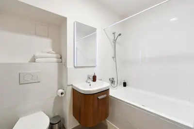 a bathroom with a sink and a toilet and a shower at Klimentská 52 Residence in Prague