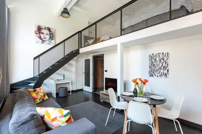 a living room with a couch and a table at Loft spacious apartments in Prague in Prague